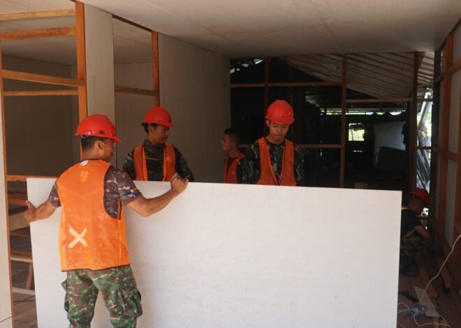 Satgas TMMD Ke-129 Lanjutkan Pemasangan Dinding Kalsiboard RTLH Milik Bapak Walianto