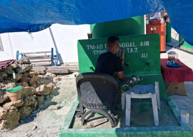 Satgas TMMD Lukis Identitas TMMD di Lokasi Manunggal Air Bersih