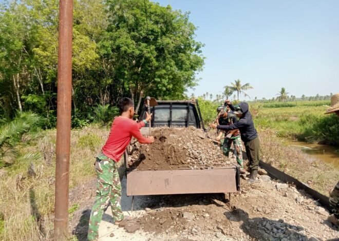 Satgas TMMD dan Warga Kompak Timbun Badan Jalan 1,2 Kilometer