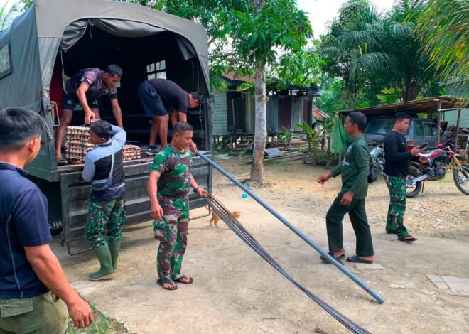 Medan Sulit Tak Halangi Satgas TMMD Angkut Material Pembangunan Desa Belatung