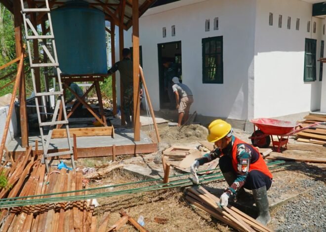 Pemasangan Keramik Tempat Wudhu Jadi Fokus Finishing Musholla Darul Iman TMMD Ke-129